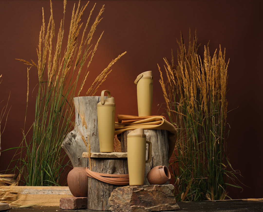 Autumn Vista FreeSip Sway bottles styled on logs against a maroon seasonal backdrop